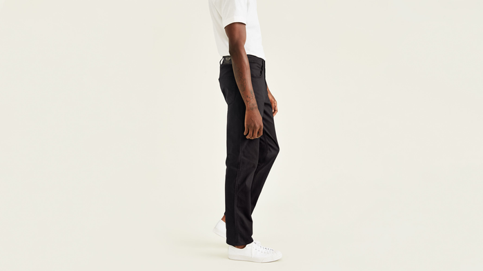 Side view of model wearing Black Jean Cut Pants, Straight Fit.