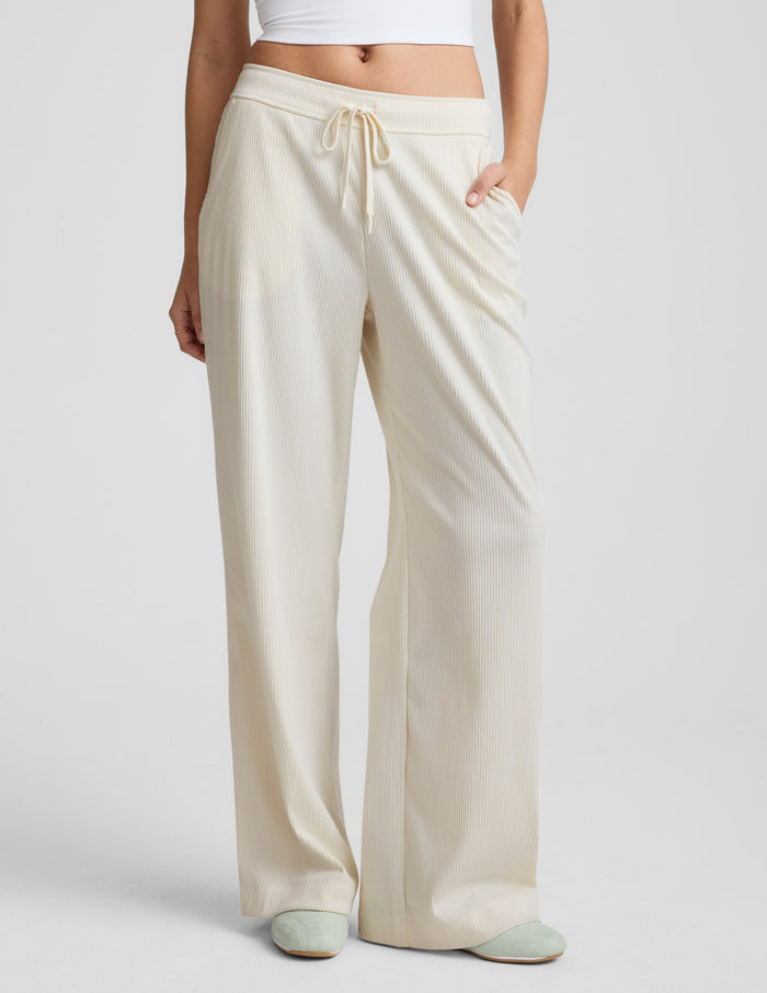 Cream Breathe Easy Comfort Cord Pant: wide-leg, ribbed corduroy pants with drawstring elastic waist and side slant pockets.