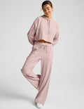 Blush Breathe Easy Ribbed Wide Leg Pant on a model, featuring a textured ribbed fabric and an adjustable drawstring waist.