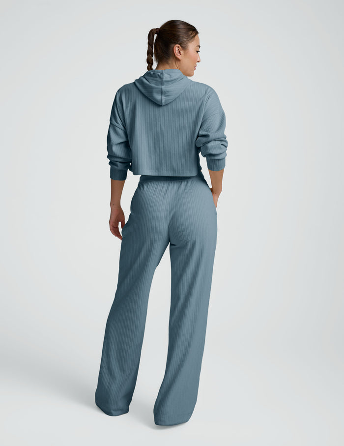 Rear view of the teal Breathe Easy Ribbed Wide Leg Pant featuring a cozy ribbed texture and relaxed wide-leg silhouette.