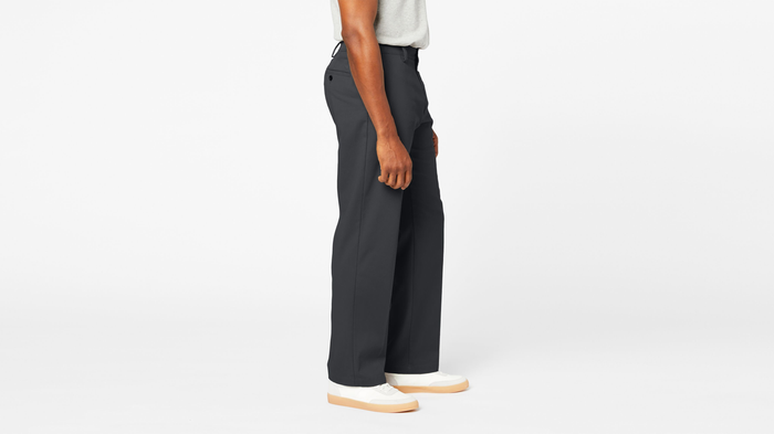 Side view of model wearing Steelhead Comfort Khakis, Relaxed Fit.