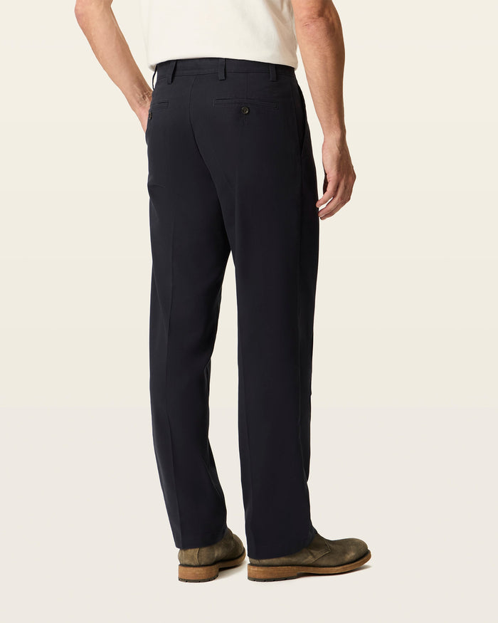 Back view of model wearing Navy Easy Khakis, Classic Fit.