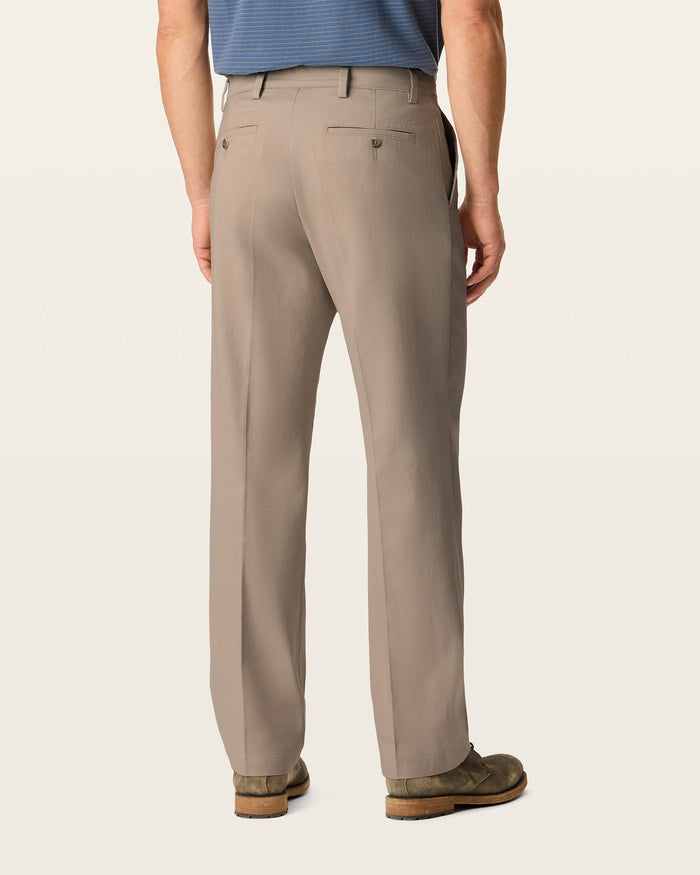 Back view of model wearing Dark Pebble Easy Khakis, Classic Fit.
