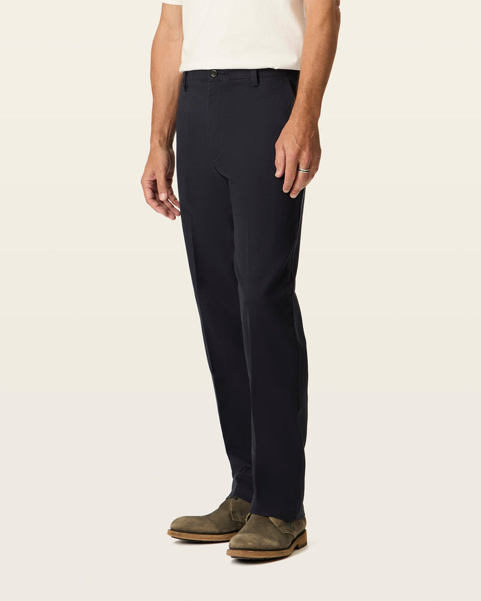 Side view of model wearing Navy Easy Khakis, Classic Fit.