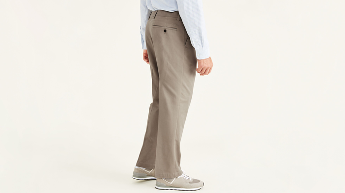 Side view of model wearing Timber Wolf Easy Khakis, Pleated, Classic Fit (Big and Tall).