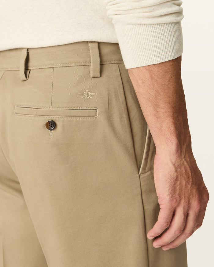 Side view of model wearing Khaki Easy Stretch Khakis, Relaxed Fit.