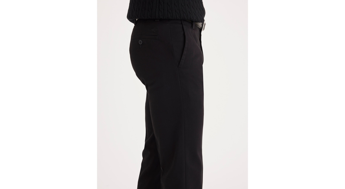 Side view of model wearing Black Easy Khakis, Slim Fit.