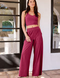 Woman wearing Fuchsia Easy Wide Leg Pant 29"™ paired with a matching tank top and side seam pockets.