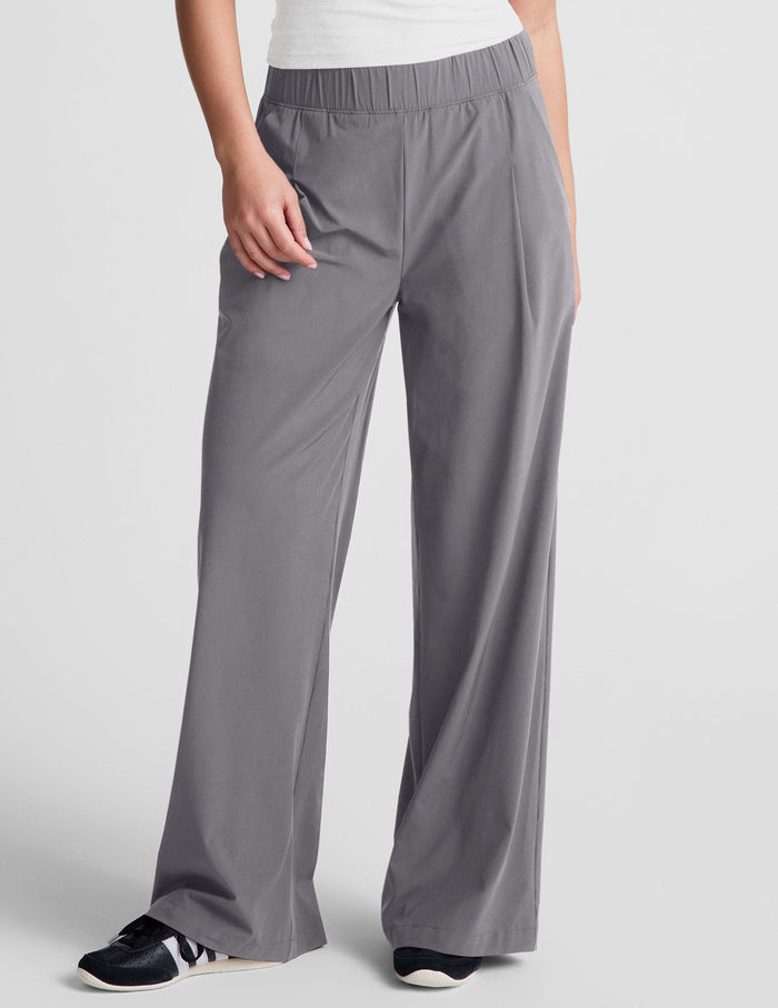 Gray Easy Wide Leg Pant featuring an elastic waistband and relaxed fit, shown from the waist down on a model.