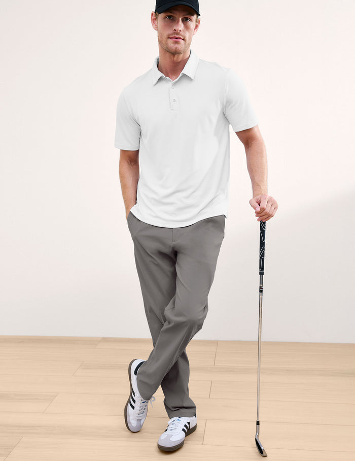 Element Men's Chino Trouser in grey. A man wears the slim-fit, straight-leg pants while holding a golf club.