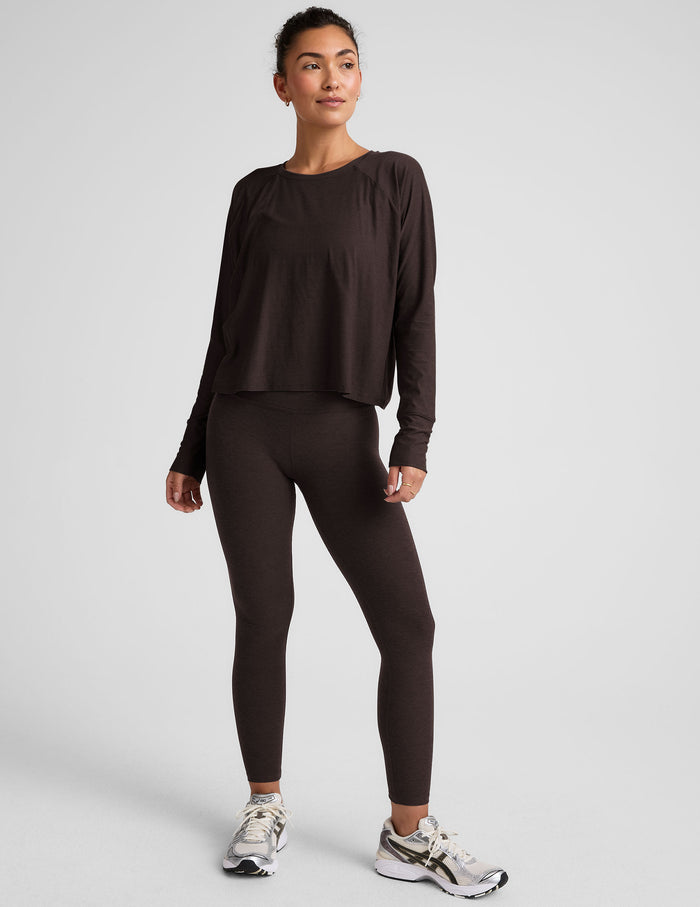 brown long sleeve crew neck top.