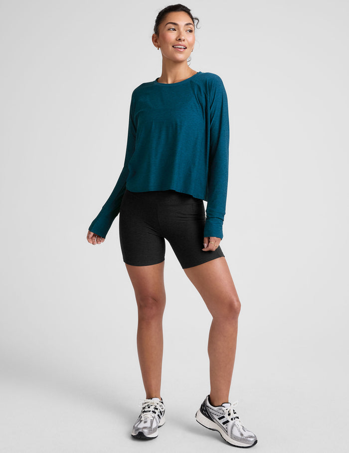 blue long sleeve crew neck top.