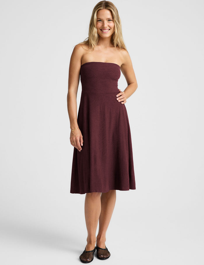 red strapless midi length dress with pockets.