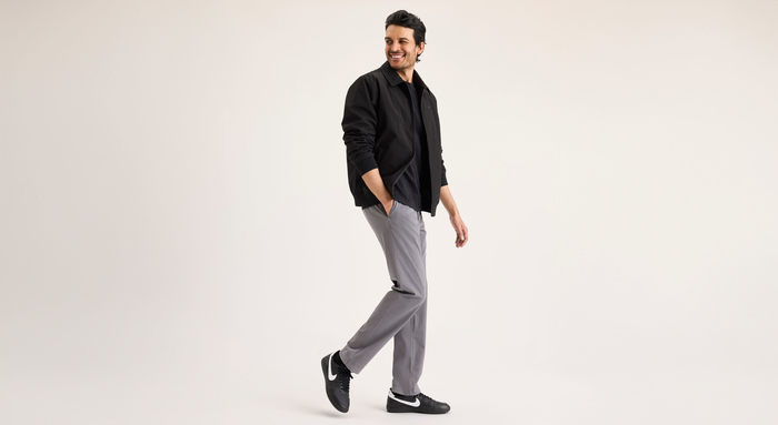 View of model wearing Car Park Grey Go Activeflex Chino, Slim Fit.