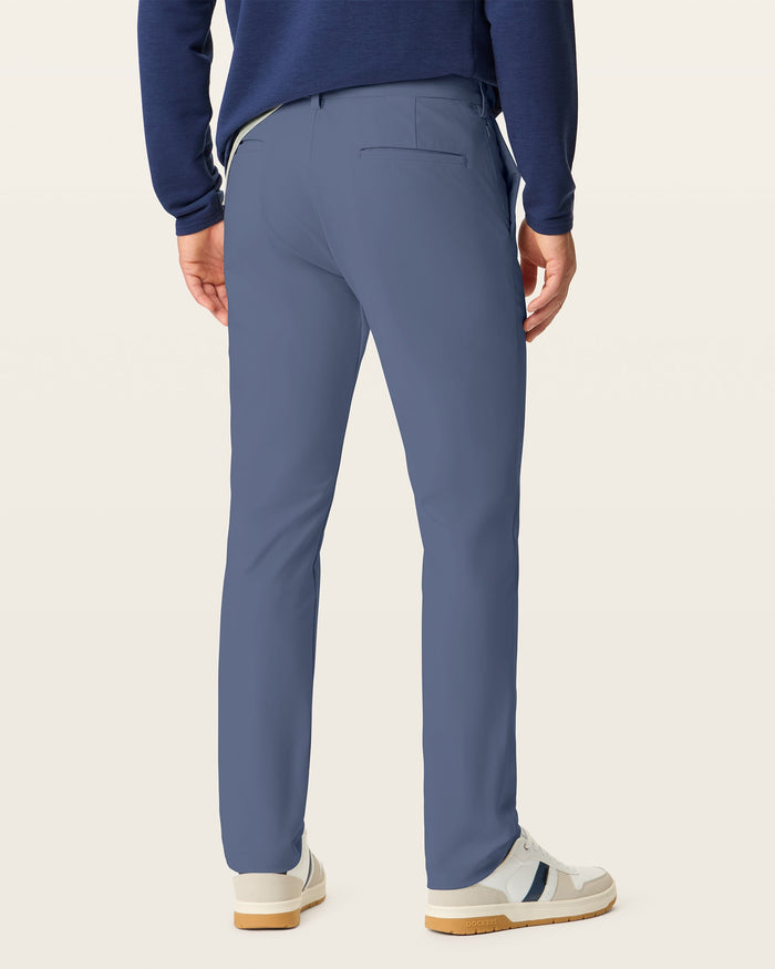 Back view of model wearing Ombre Blue Go Airweave Chino, Straight Fit.