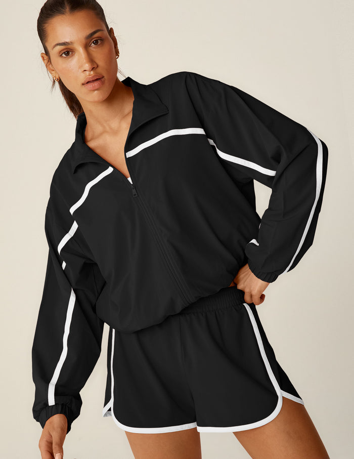 black zip-up jacket with white lining.