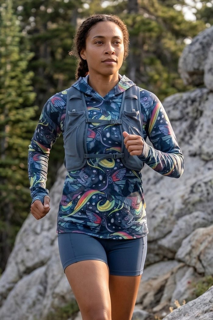 Woman running outdoors in a colorful outfit with a vest