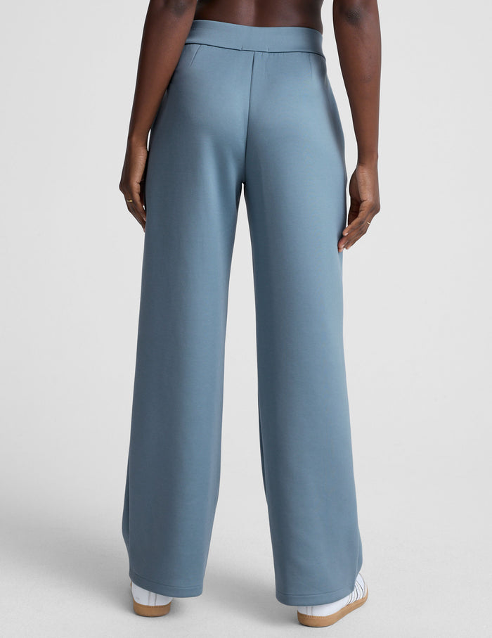 Back view of ice blue In The Flow Wide Leg Pant showing the elastic waistband, welt pockets, and full-length wide leg fit.