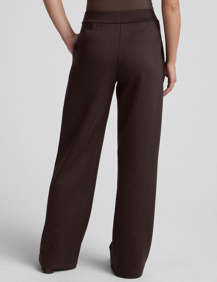 Back view of the dark brown In The Flow Wide Leg Pant, showing the high-waisted fit and full-length, loose silhouette.