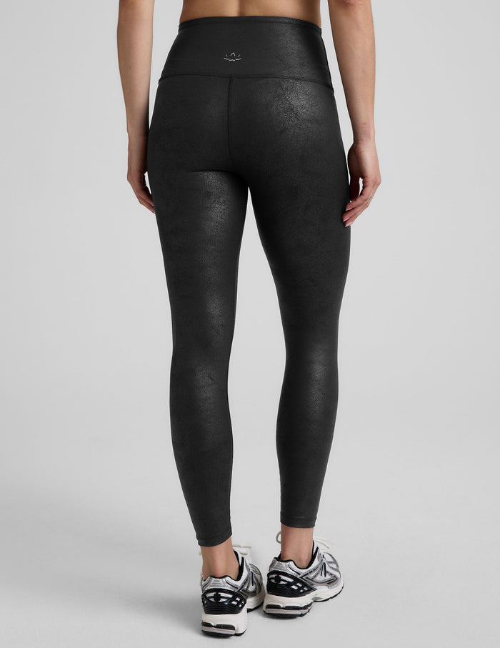 black faux leather high-waisted midi leggings.