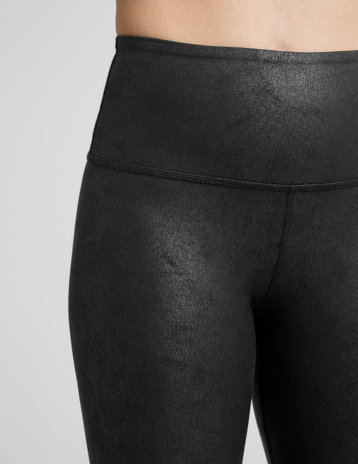black faux leather high-waisted midi leggings.