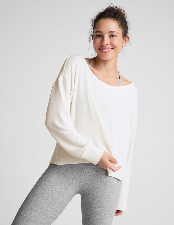 white boatneck long sleeve pullover.