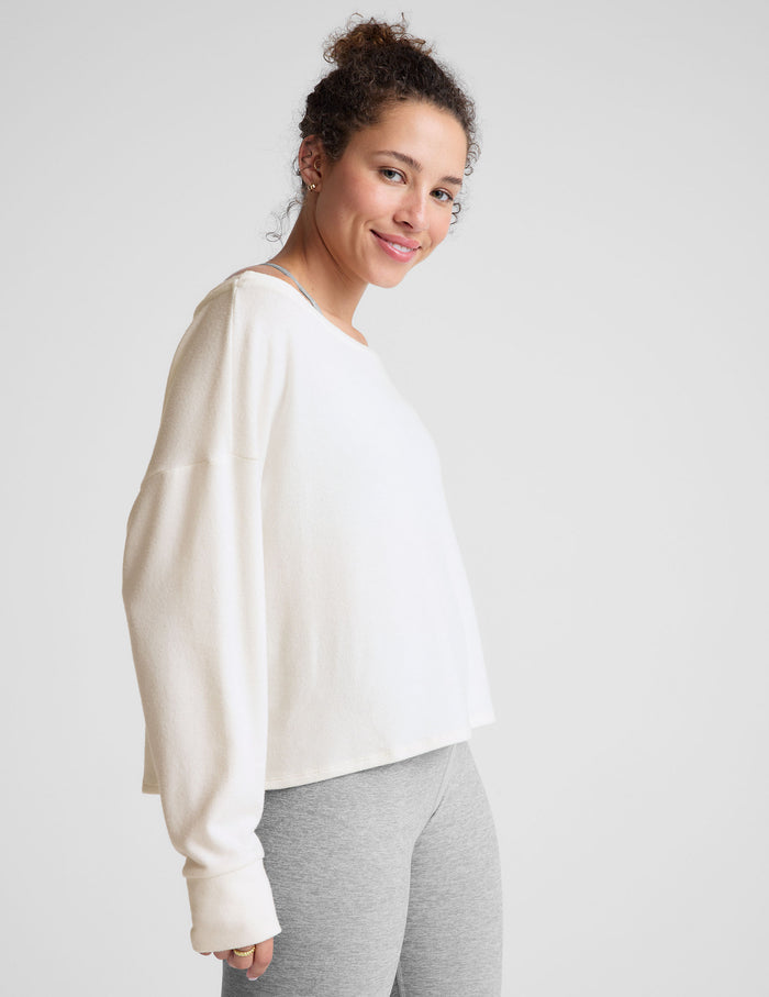 white boatneck long sleeve pullover.