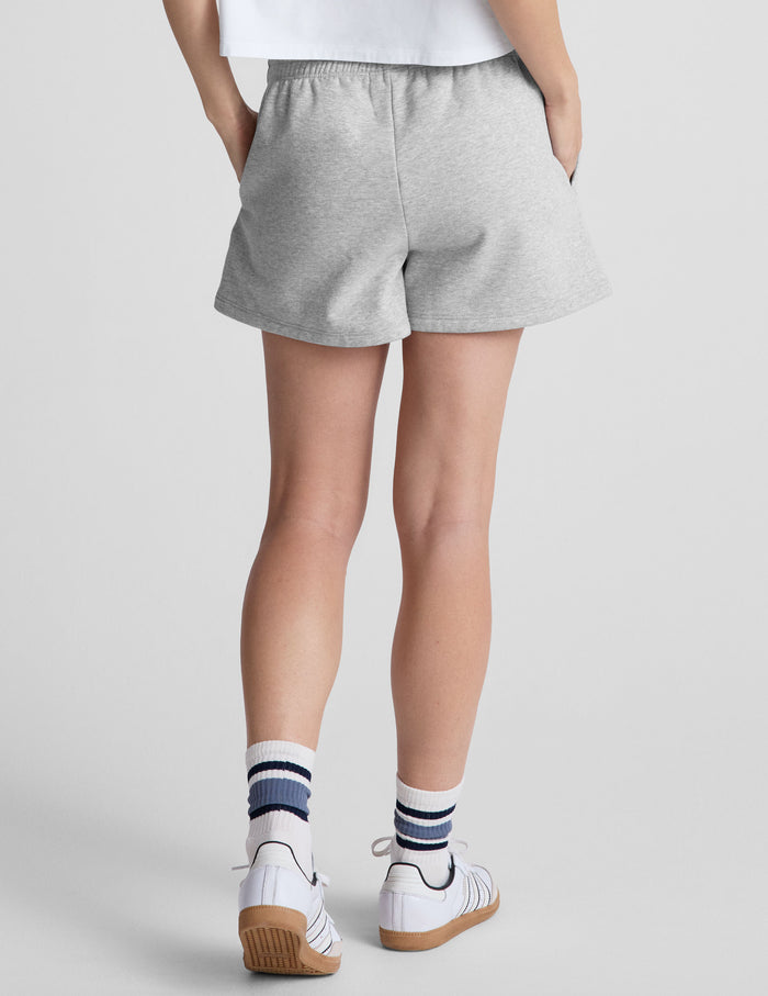 Rear view of gray marled LuxeFleece Sweat Shorts featuring a relaxed fit, mid-rise elastic waist, and side seam pockets.