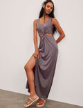 brown v-neck tank maxi length dress with cutouts at the waist.