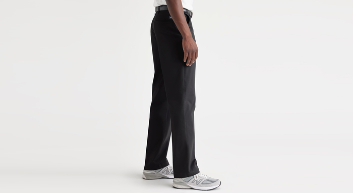 Side view of model wearing Beautiful Black Essential Chinos, Classic Fit.