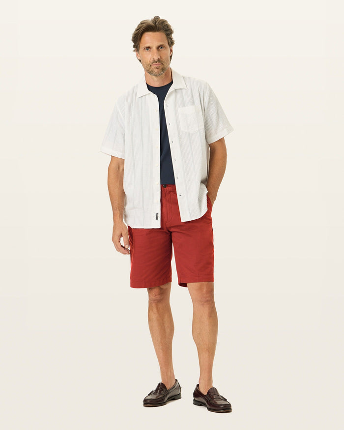 Front view of model wearing Bank Red Perfect 10.5" Shorts.