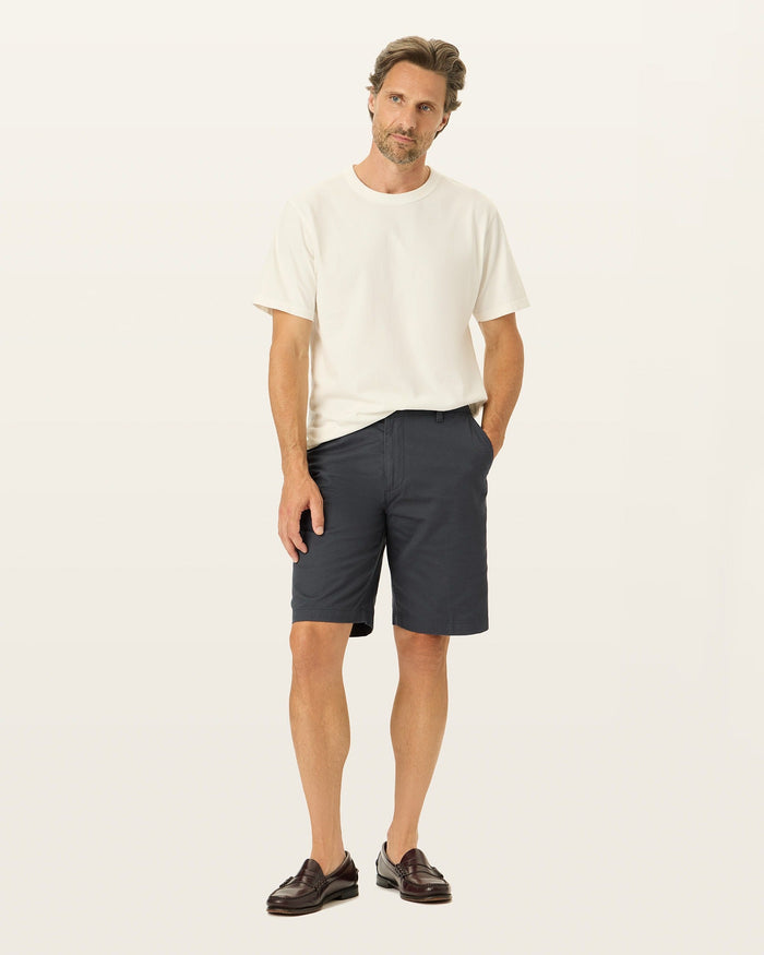 Front view of model wearing Black Perfect 10.5" Shorts.