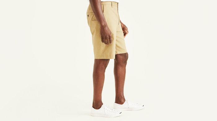 Side view of model wearing New British Khaki Perfect 10.5" Shorts.