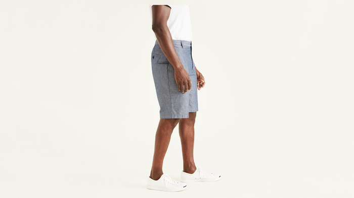 Side view of model wearing Clarke Chambray Faded Navy Perfect 10.5" Shorts.