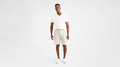 Front view of model wearing Porcelain Khaki Perfect 8" Shorts, Classic Fit.