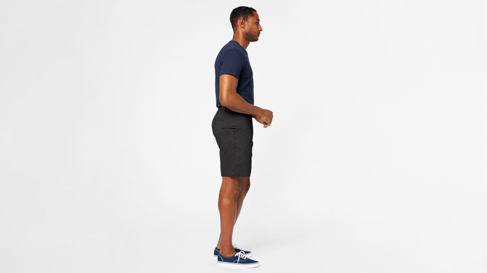 View of model wearing Black Perfect 8" Shorts.