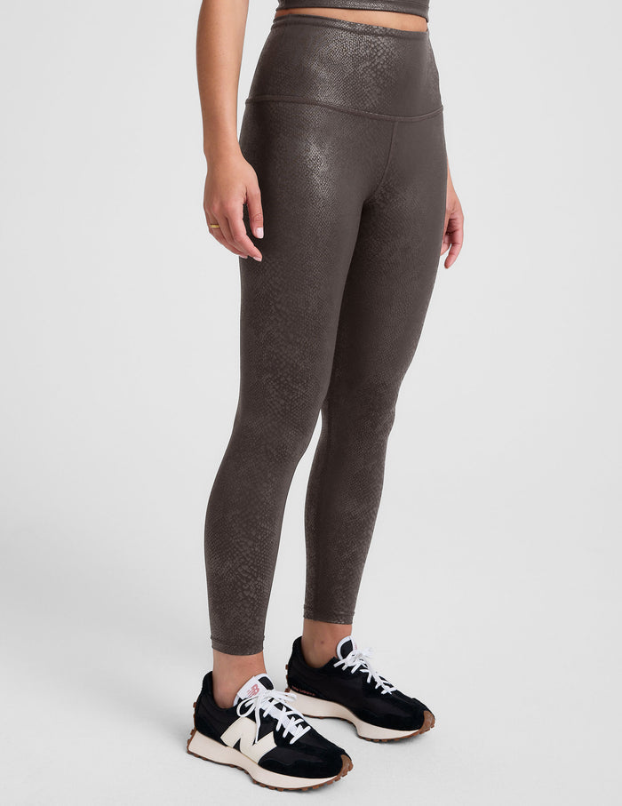 brown viper printed high-waisted midi length leggings.