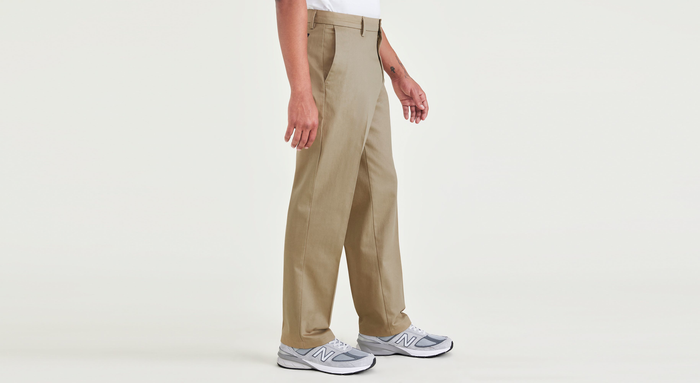 Side view of model wearing New British Khaki Signature Iron Free Khakis, Classic Fit with Stain Defender® (Big and Tall).