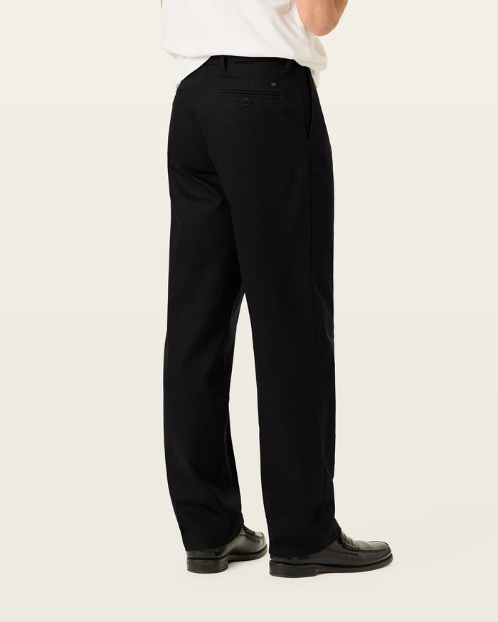 Back view of model wearing Beautiful Black Signature Iron Free Khakis, Classic Fit with Stain Defender®.