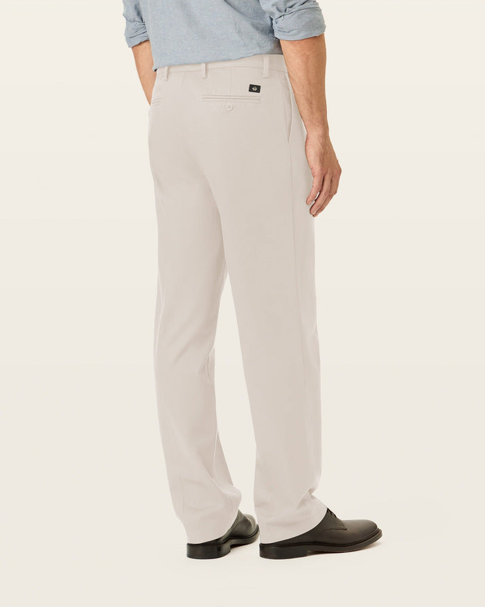 Back view of model wearing Cloud Signature Iron Free Khakis, Classic Fit with Stain Defender®.
