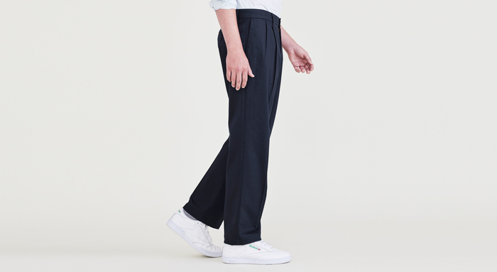 Side view of model wearing Navy Blazer Signature Iron Free Khakis, Pleated, Classic Fit with Stain Defender® (Big and Tall).
