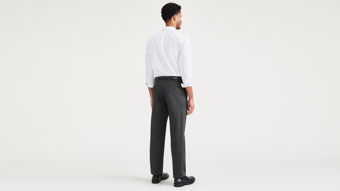 Back view of model wearing Steelhead Signature Iron Free Khakis, Pleated, Classic Fit with Stain Defender®.