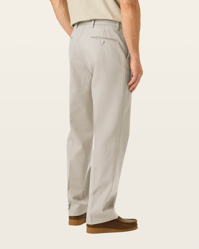 Back view of model wearing Cloud Signature Iron Free Khakis, Relaxed Fit with Stain Defender®.