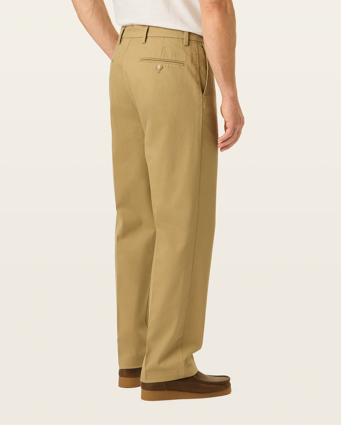 Back view of model wearing New British Khaki Signature Iron Free Khakis, Relaxed Fit with Stain Defender®.