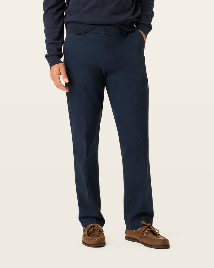 Side view of model wearing Navy Blazer Signature Iron Free Khakis, Straight Fit with Stain Defender®.
