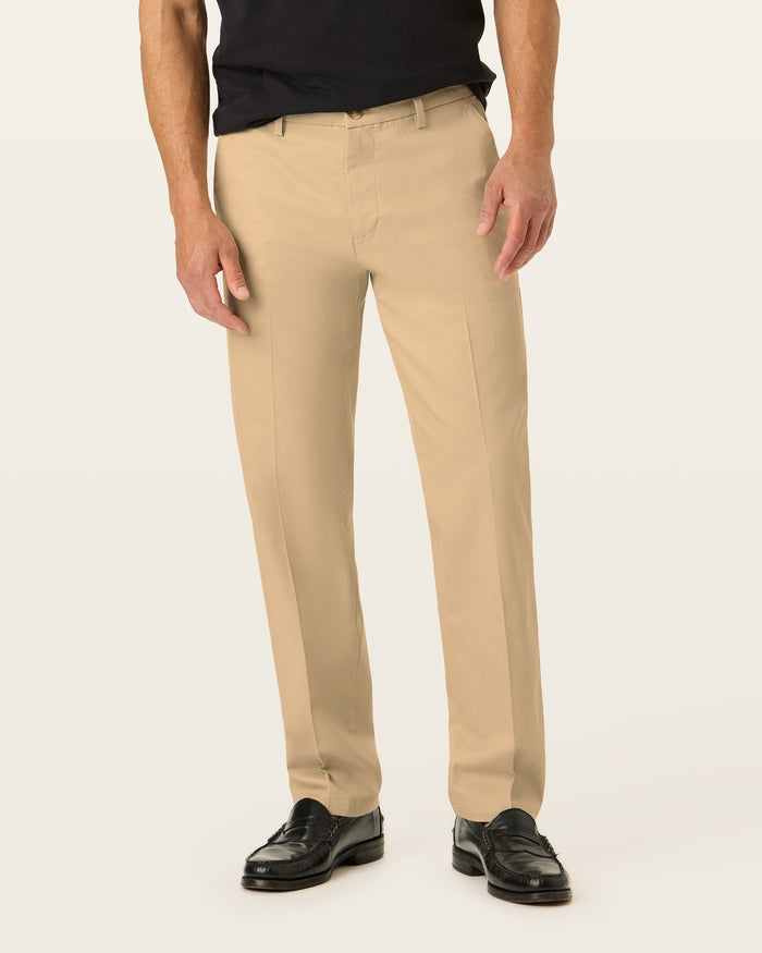 Front view of model wearing New British Khaki Signature Iron Free Khakis, Straight Fit with Stain Defender®.