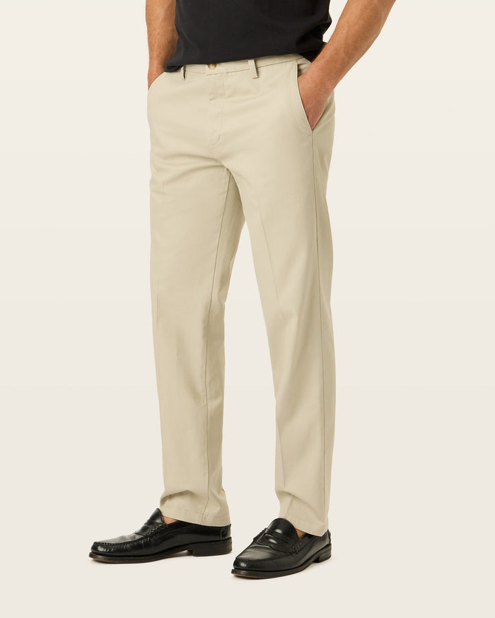 Side view of model wearing Cloud Signature Iron Free Khakis, Straight Fit with Stain Defender®.