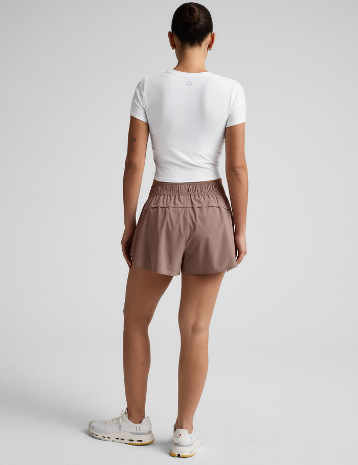 Rear view of brown Solemate 2.5" Short featuring a gathered elastic waistband and vented back panel for breathability.