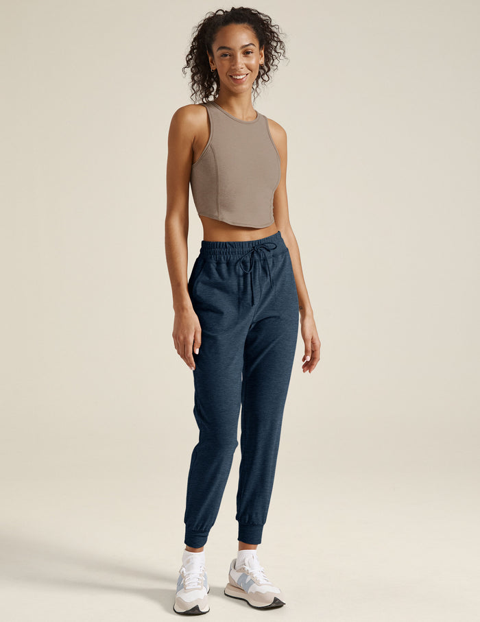 Navy Spacedye Commuter Midi Jogger with high-waisted drawstring and slim fit, shown on a model with banded cuffs.
