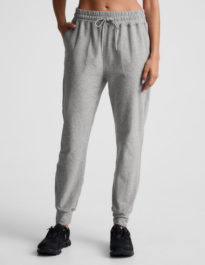 Model wears gray Spacedye Commuter Midi Jogger featuring a drawstring waist, side pockets, and slim-fit legs with cuffed hems.